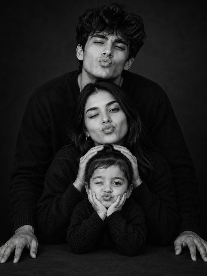Playful Monochrome Family Portrait 🖤 — AI image prompt example generated with this prompt